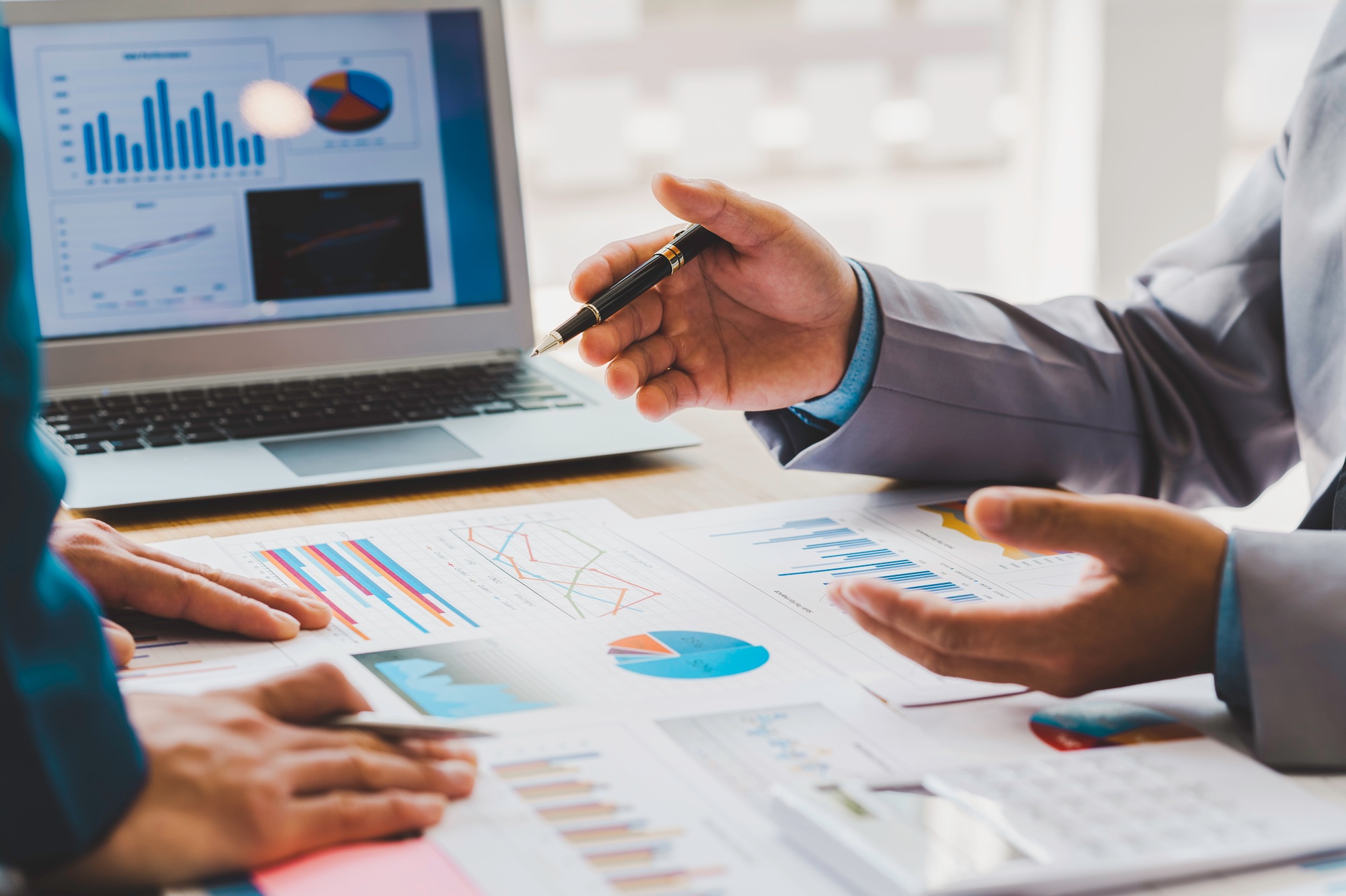 Business meeting, business people are meeting to analyze data for the marketing plan. Concept of fin