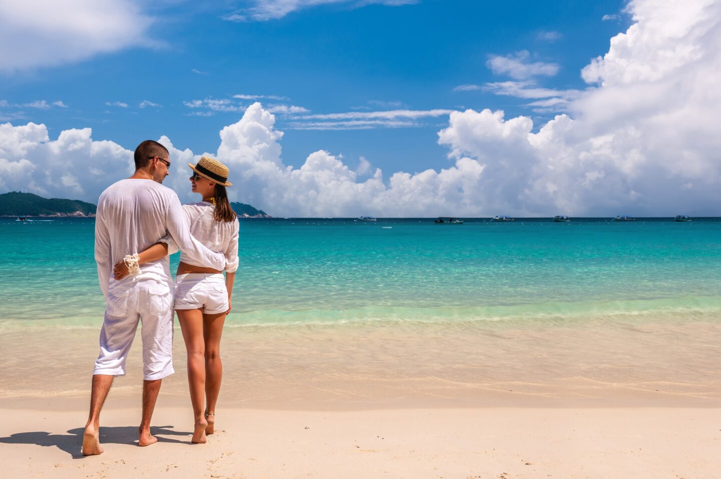 Couple in white on a beach
