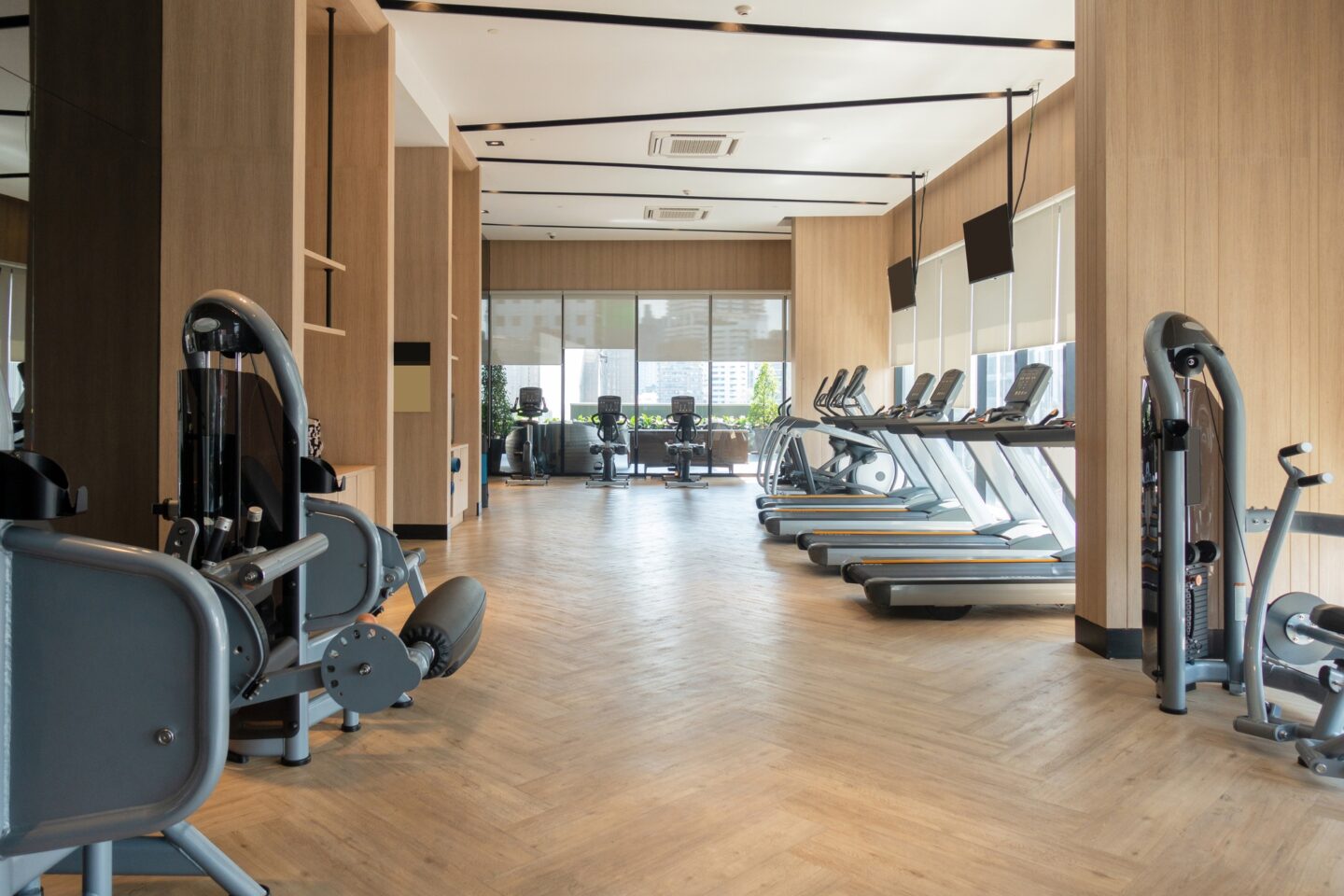 Modern fitness center with gym equipment decoration. Interior design background